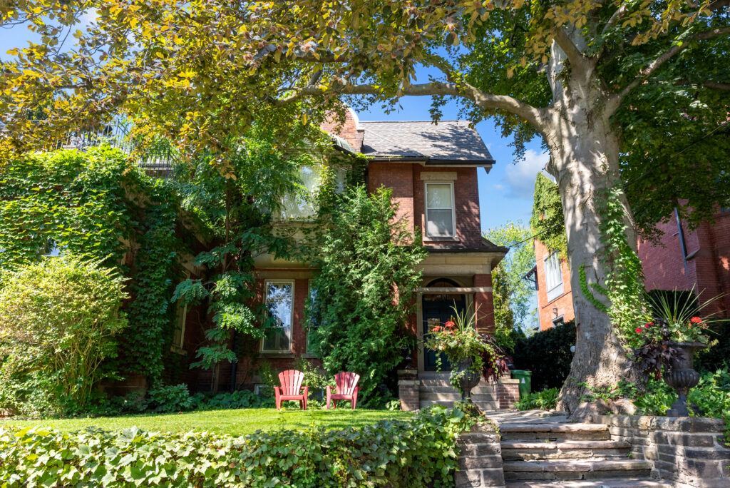 6 Dale Avenue rental property - a classic red brick house surrounded by trees